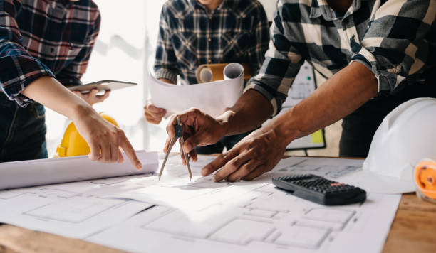 istock Engineer Teamwork Meeting, Drawing working on blueprint meeting for project working with partner on model building at company office. Asian industry professional team 1463479427