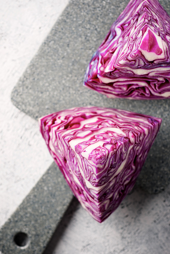 Red cabbage pieces on a chopping board