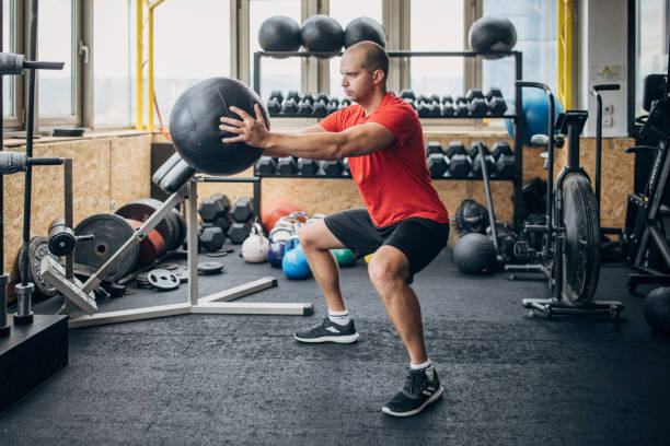 istock Man training with medicine ball 1463480511