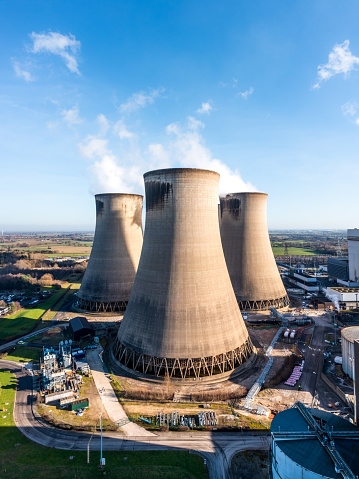 A vertical  aerial view of a group of cooling towers at a coal fired power station