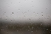 Rain drops on transparent window glass, wet glass