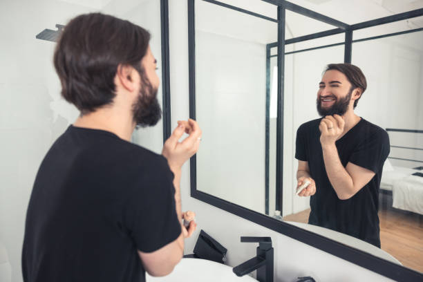 istock Smiling transgender person admiring his appearance after the makeup application 1463483703