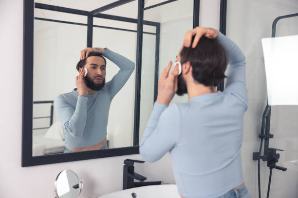 istock Guy removing his makeup in the bathroom 1463483779