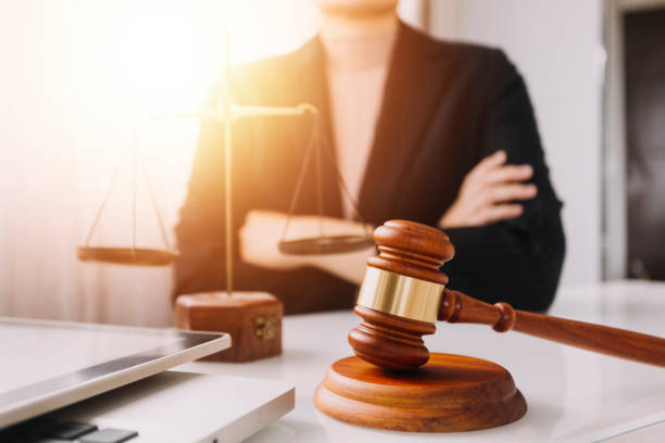 Business and lawyers discussing contract papers with brass scale on desk in office. Law, legal services, advice, justice and law concept Business and lawyers discussing contract papers with brass scale on desk in office. Law, legal services, advice, justice and law concept bar drink establishment stock pictures, royalty-free photos & images