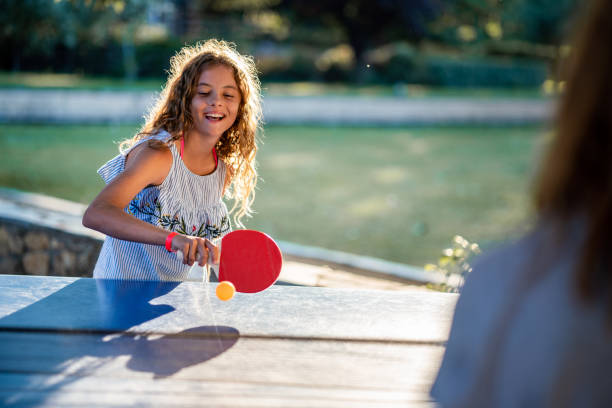 istock Girls playing table tennis on summer day 1463487070