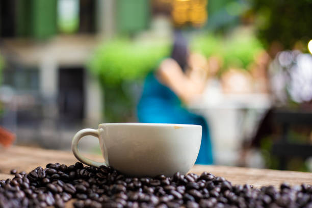 Hot latte art coffee with coffee bean on wooden table business drinking