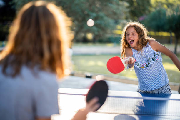istock Girls playing table tennis on summer day 1463487508