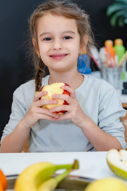 istock Children eating a fruit snack in a kindergarten 1463487840
