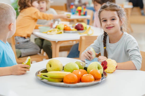 istock Children eating a fruit snack in a kindergarten 1463488003