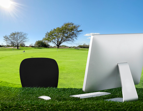 Desk with computer on a golf course