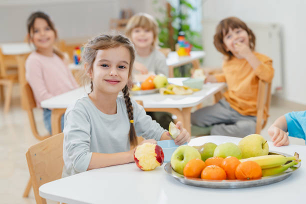 istock Children eating a fruit snack in a kindergarten 1463489061