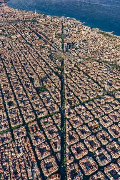 Photo of Aerial view of typical buildings of Barcelona cityscape from helicopter. top view, Eixample residencial urban grid