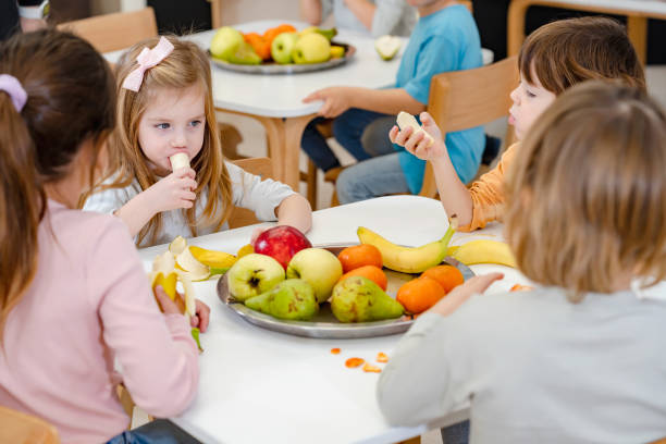 istock Children eating a fruit snack in a kindergarten 1463491901