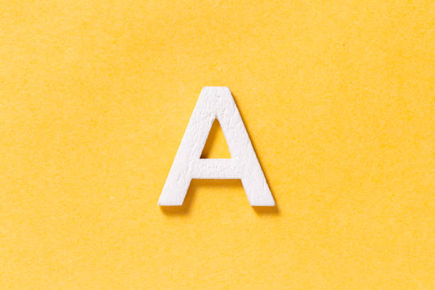 istock Letter A of the alphabet isolated on yellow background, top view 1463492012