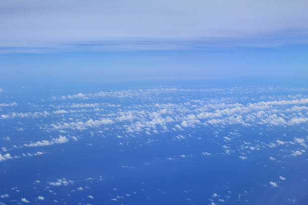 istock Cloudscape background. View from above, out of an airplane window. Grey cloudy sky. 1463492399
