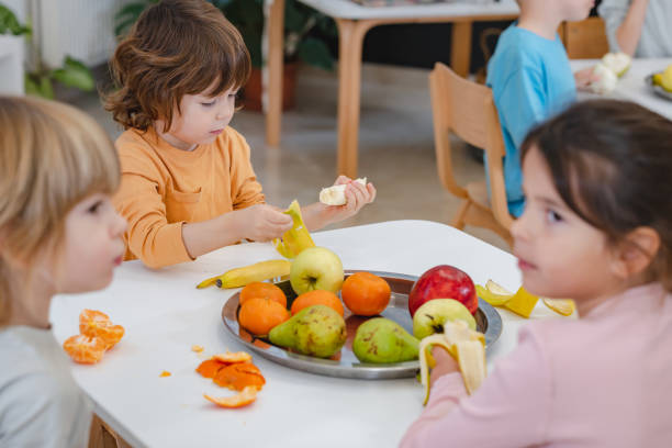istock Children eating a fruit snack in a kindergarten 1463492497