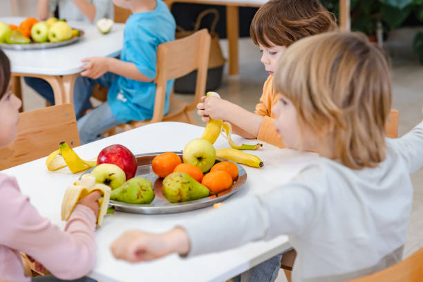 istock Children eating a fruit snack in a kindergarten 1463492665