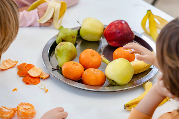 istock Children eating a fruit snack in a kindergarten 1463492859