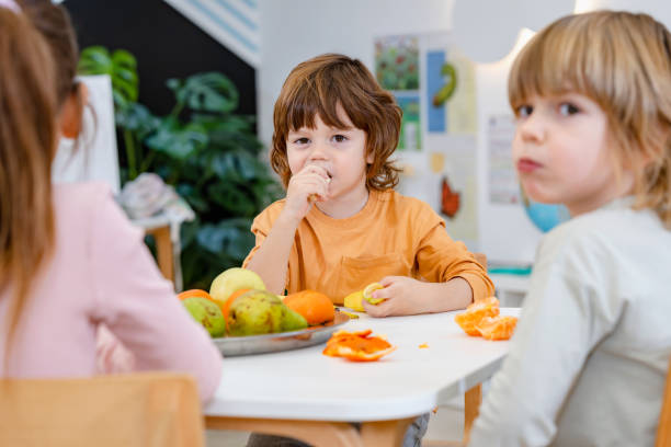 istock Children eating a fruit snack in a kindergarten 1463492864