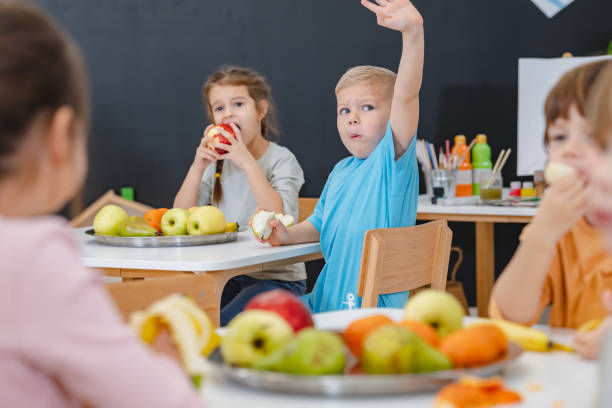 istock Children eating a fruit snack in a kindergarten 1463493407