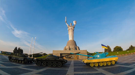 Museum of the History of Ukraine in World War II, Kiev.   Confrontation tanks on the background of the statue of Motherland.