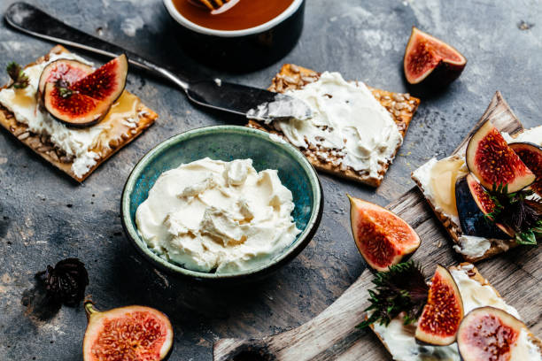 Philadelphia cheese crackers and figs. Healthy snack. Keto diet. Keto snack, top view stock photo