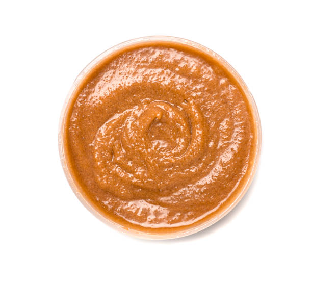 istock Natural chocolate scrub isolated on white, top view 1463496691