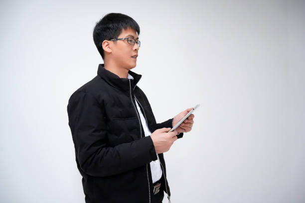 istock Portrait of businessman, white collar, salaryman using tablet 1463497672