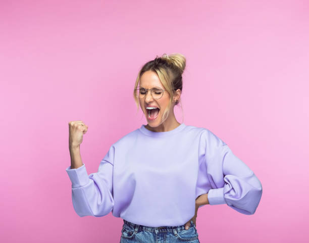 istock Ecstatic woman with clenched fist 1463497879