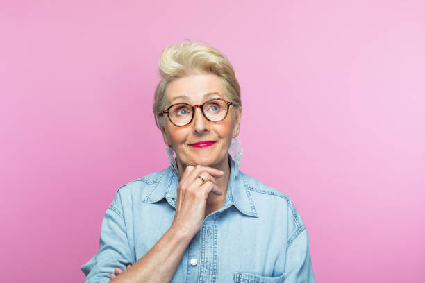 istock Thoughtful elderly woman with hand on chin 1463499742