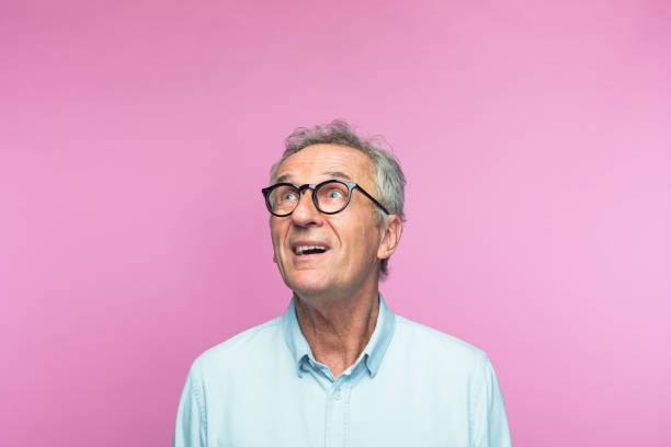 istock Amused retired elderly man looking up 1463499838