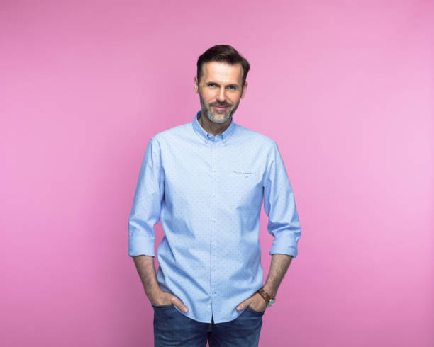 istock Confident mid adult man with hands in pockets 1463500492