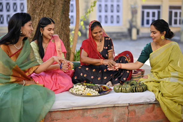 istock Beautiful women in saris trying bangles from a local Bangle Vendor 1463501567