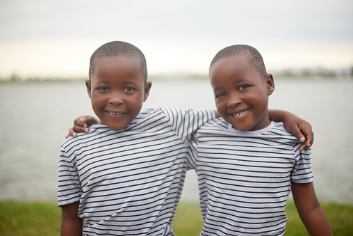 african toddler playing in his yard village in botswana