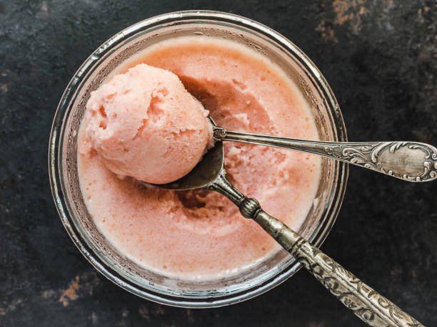 Homemade ice cream and ripe, juicy peaches