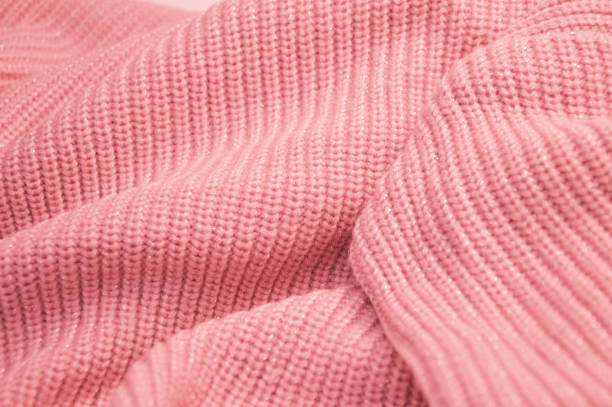 istock Coral pink knitted texture background. Knitted fabric. Abstract background. 1463510836