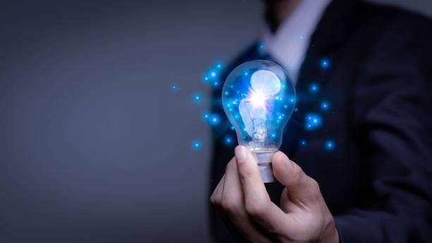 istock Businessman holding a light bulb, Creative new idea. Innovation, brainstorming, solution and inspiration concepts. imagination, creative thinking problem solving. 1463511931