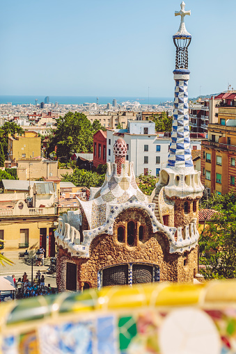 The stunningly vibrant colours and twisting shapes of the Spanish architect Gaudi's famous Parc Guell in Barcelona, Spain.