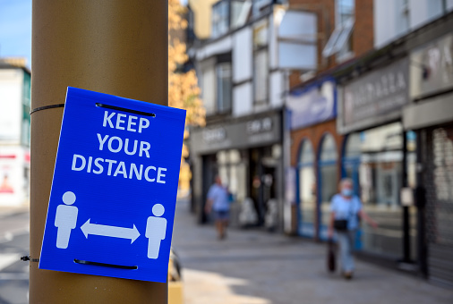 Keep your distance sign in Bromley High Street during the coronavirus pandemic. Sign in focus, background blurred. Bromley (London) in Kent, UK.