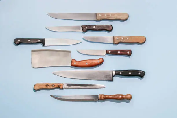variety of butcher knives on colorful background
