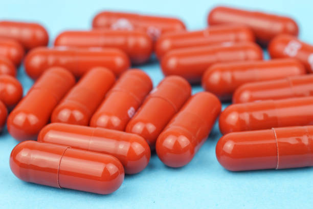 istock Assorted pharmaceutical medicine pills, tablets and capsules over blue background 1463529294