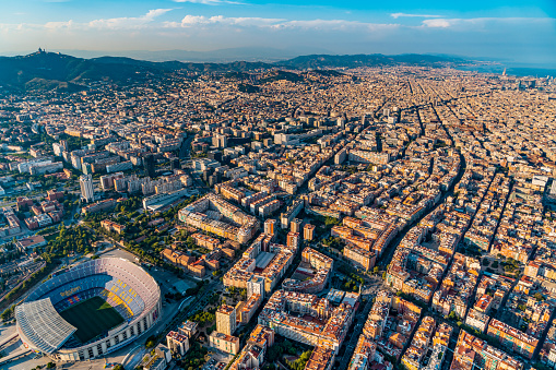 Barcelona - December, 2020: Aerial helicopter view of Camp Nou FC Barcelona football Stadium in Barcelona and the city. It is the most famous stadium in Catalonia.