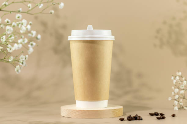istock Disposable eco friendly cardboard cup with coffee beans 1463531411