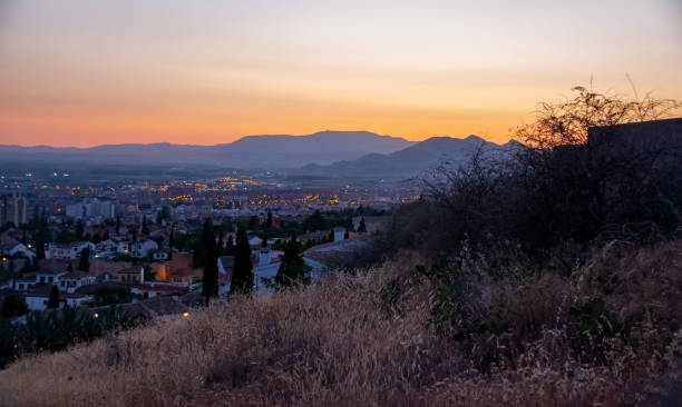 istock A beautiful sunset over a mountain range and town 1463533854