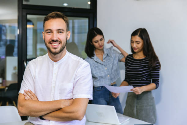 istock Handsome businessman working on laptop in bright modern office 1463533954