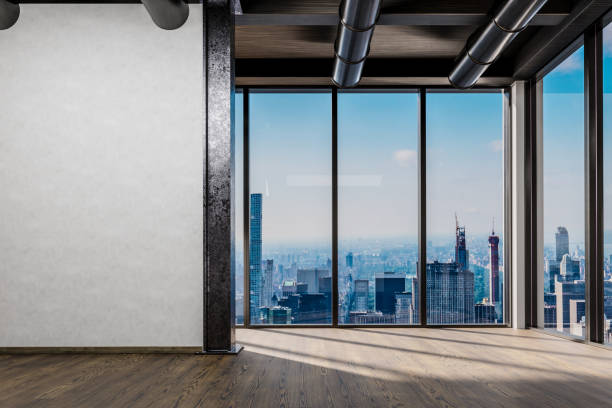 istock large office with blank white wall and copy space in front of panoramic window skyline view, 3D Illustration 1463534918