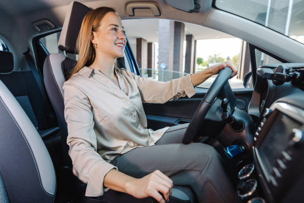istock Young woman driving car and enjoying 1463544420