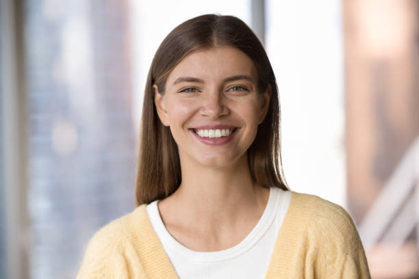 istock Happy beautiful young 20s woman looking at camera 1463545810