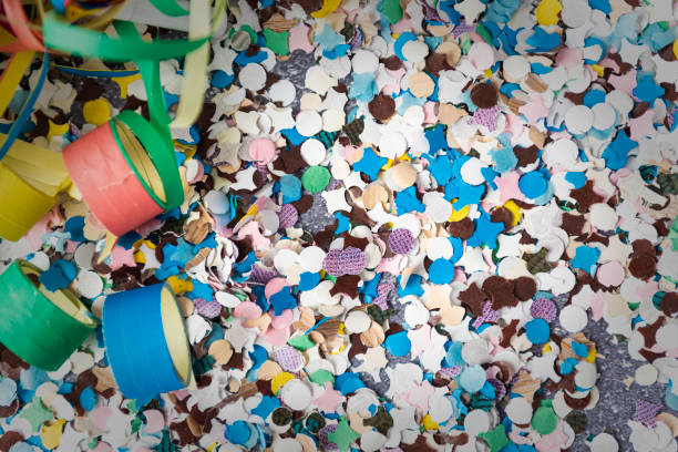 Carnival themed background with confetti, blowers and streamers