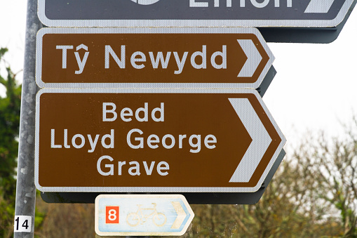 Sign for David Lloyd George grave in Llanystumdwy , a village associated with David Lloyd George. Criccieth, North Wales, UK, landscape